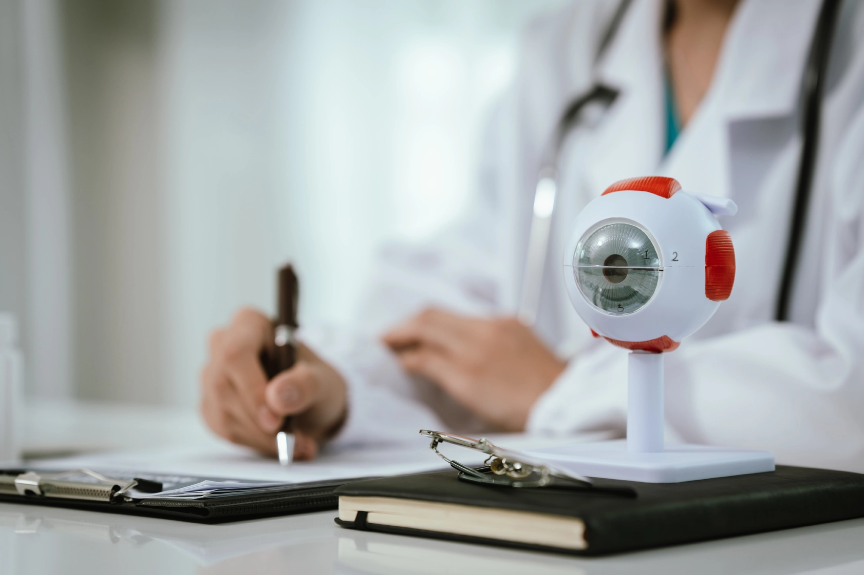Ophthalmologist assessing a patient's suitability for surgery during a consultation