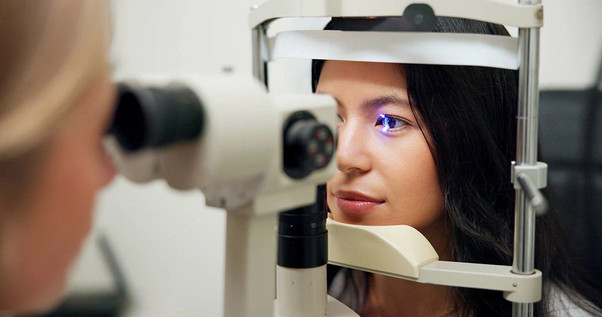 A woman receiving an eye check-up